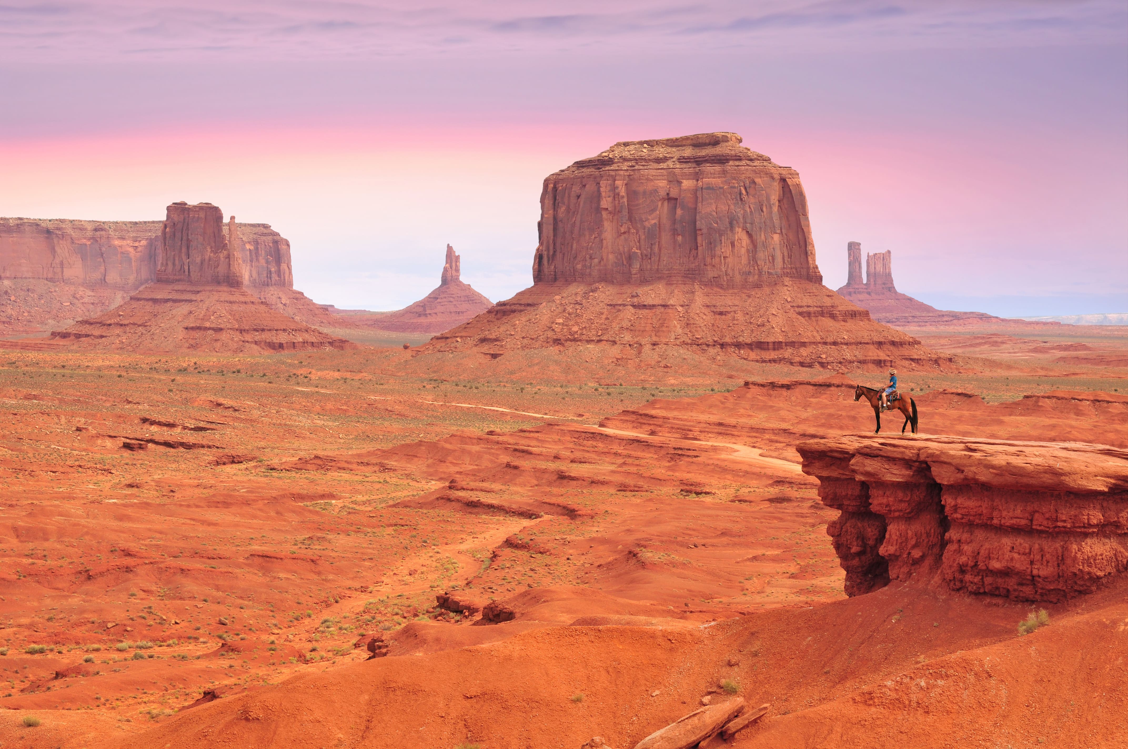 Horseback riding at sunset in Monument Valley.